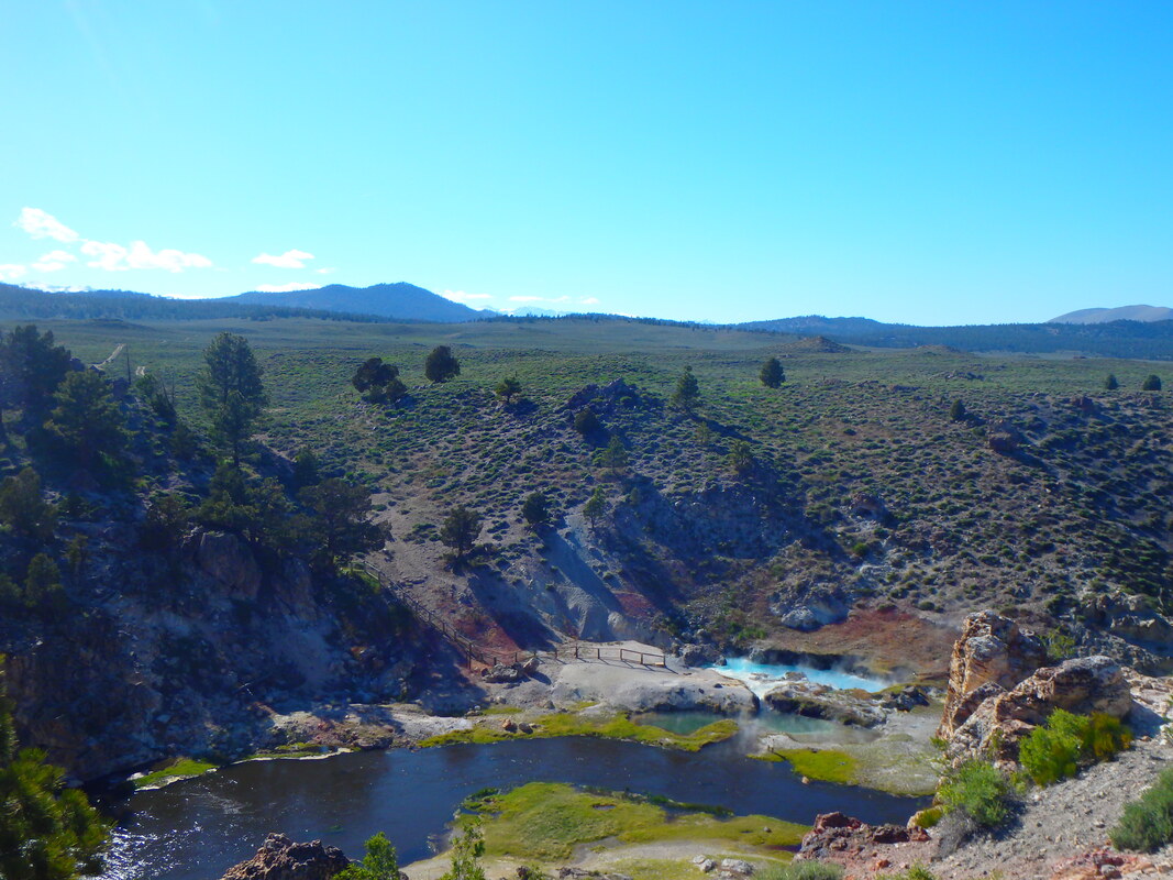 A Picture of the bright turquoise pools at Hot Creek