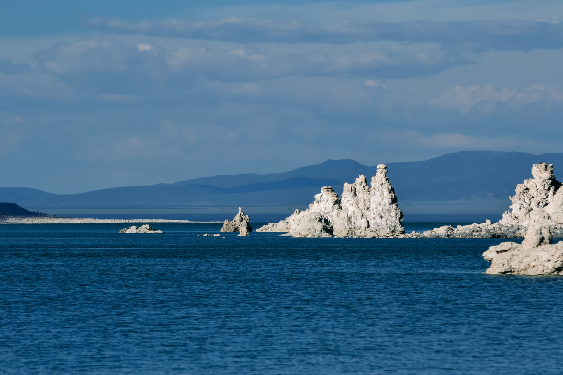 A Picture of white tufa towers at Mono Lake overlooking deep blue water